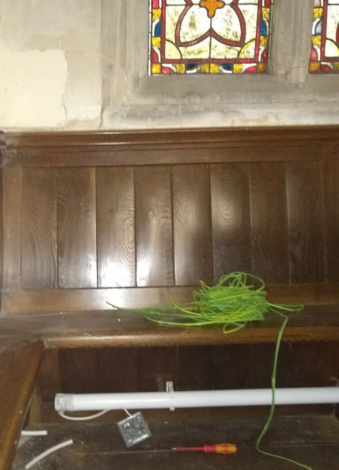 Part way through installing a pew heater Part way through installing a heater in a church pew
